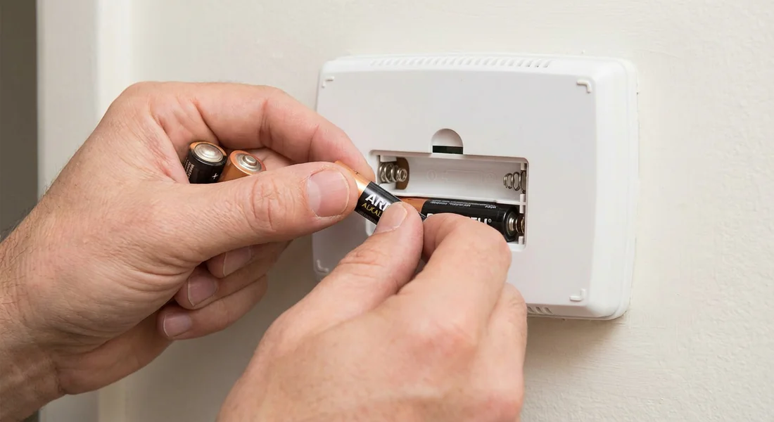Changement des piles d'un thermostat de chaudière